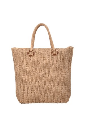 Stor beige flettet shoppertaske med to runde håndtag fastgjort med cirkulære træ-ringe.