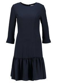 Námořnická modrá šaty s kulatým výstřihem, tříčtvrtečními rukávy a rozšířeným volánkovým lemem. Vyrobeny z hladké tkaniny s minimálním šitím.