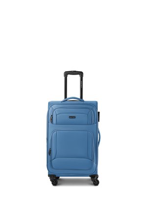 Blue soft-shell suitcase with telescoping handle extended, front zip pockets, side handle, and four black spinner wheels.