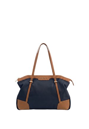 Borsa tote blu navy con manici e rifiniture in pelle marrone, dotata di zip superiore e targhetta con logo dorato al centro in alto.