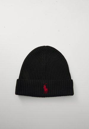 Black ribbed knit beanie with folded edge and small red embroidered polo player logo on front center.