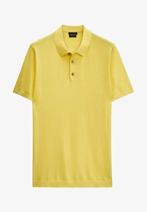 Polo jaune à manches courtes avec patte de boutonnage à deux boutons et col, tissu en maille unie, présenté à plat sur fond blanc.