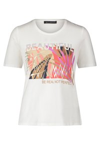 T-shirt blanc à manches courtes avec un graphisme coloré portant les mots "BEAUTIFUL" et "SOIS RÉEL, PAS PARFAIT", illustré par des designs inspirés des plantes.
