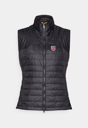 Black sleeveless puffer vest with a high collar, horizontal quilted texture, front zip closure, and a logo patch on the left chest.