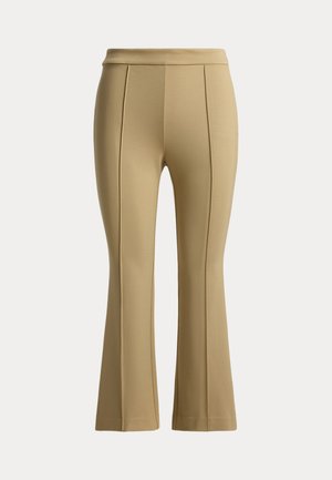 Μπεζ ψηλόμεσο παντελόνι με ραφές στο μπροστινό μέρος και ελαφριά φούντα στο τελείωμα, απεικονισμένο σε λευκό φόντο.