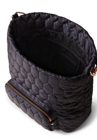 Black quilted handbag with honeycomb pattern, gold zipper pocket on front, open top showing textured inner lining and small interior zip pocket.