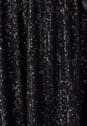 Black fabric adorned with flat silver sequins, creating a textured, reflective surface. The sequins are densely arranged, catching light.