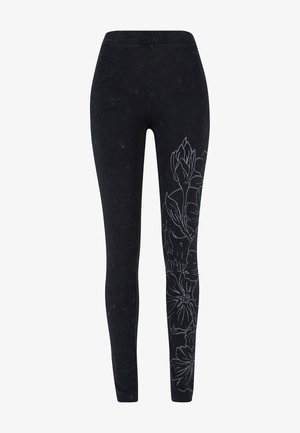 Mustad mustad, millel on külgedel valge lillemuster, pehmest materjalist, sileda tekstuuriga ja ühte kiiresti sobituva kujundusega.