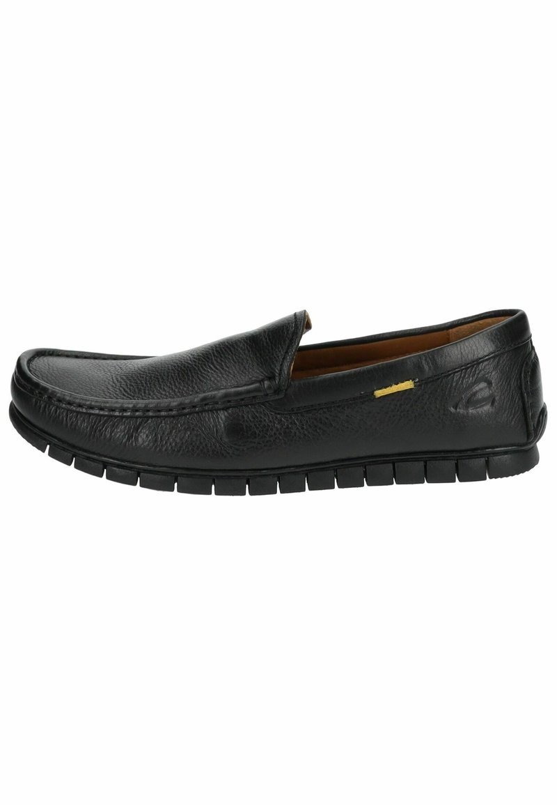 Mocassin noir en cuir à enfiler avec surface texturée, semelle souple rainurée et un petit détail en tissu jaune sur le côté.