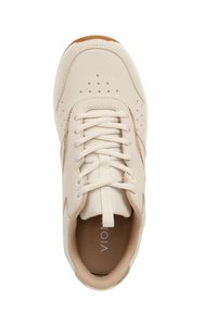 Beige sneaker with perforated design, textured accents, flat laces, and a rounded toe. Features a soft interior and natural rubber sole.