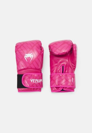 Pink boxing gloves with glossy finish, featuring a geometric pattern, white branding, cushioned knuckles, and a black Velcro strap.