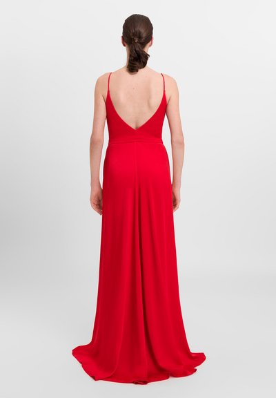 Red, sleeveless evening dress with a V-back, floor-length design, made of smooth fabric, featuring a fitted bodice and flowing skirt.