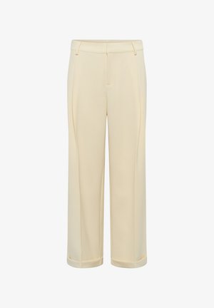 Pantalon ajusté couleur crème avec passants de ceinture, pli avant et ourlets à revers, présenté sur fond blanc.
