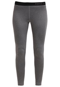 Leggings de sport Nike Pro pour homme en gris, avec une taille élastique noire et une couture centrale à l'avant, design slim-fit full-length.
