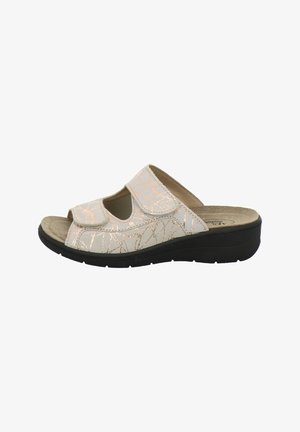 Beige open-toe slide sandal with adjustable straps, metallic swirl pattern, cushioned insole, and black wedge sole.