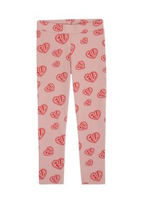 Rosa leggings med ett repetitivt hjärtformat mönster i rött med texten "FILA" inuti hjärtana. Tillverkade av elastiskt, mjukt material.
