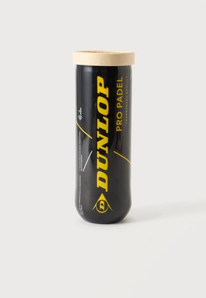 Čierny valcovitý kontajner na loptičky Dunlop Pro Padel so žltým textom a béžovým viečkom na bielom pozadí.