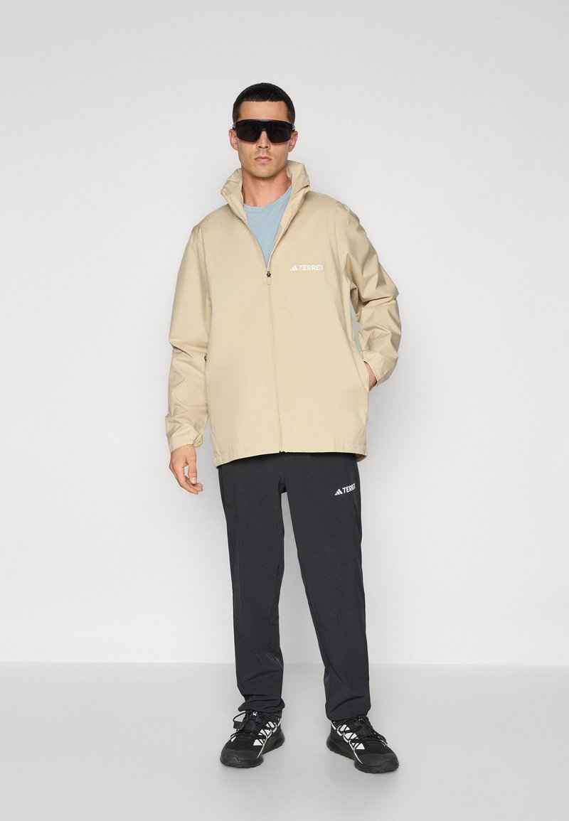 adidas Terrex Regenjas lichtbruin