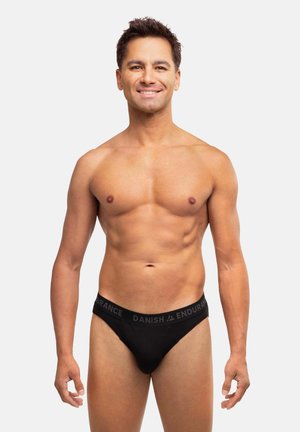 Sorte bomuldsunderbukser med en bred elastisk linning med teksten "DANISH ENDURANCE" i grå. Tætsiddende design, glat tekstur, minimal dækning.