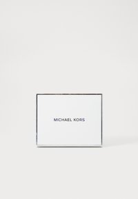 White rectangular card featuring "MICHAEL KORS" in navy text. Edges have a silver border, presenting a clean and simple design.