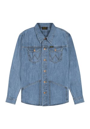 Világoskék farmerring, hosszú ujjakkal, hegyes gallérral, fém gombokkal az elején, valamint négy zsebbel, két mellkason és két alsó elülső zsebbel.