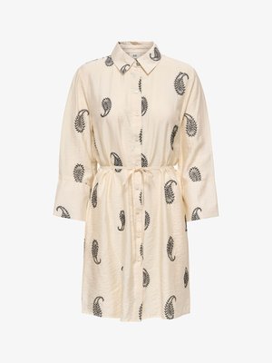 Krém színű ingruha fekete paisley mintákkal, gombos elöl, hosszú ujjú, hegyes gallérral és derékban megkötős övvel.