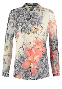 Transparante bloemenblouse met een mix van zwarte, roze en witte patronen, knoopsluiting aan de voorkant en een gekraagde halslijn met decoratieve accenten.