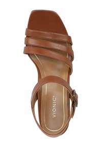 Brown leather sandal featuring three wide straps, a square toe, an ankle strap with a buckle, and a smooth inner lining. Brand: Vionic.