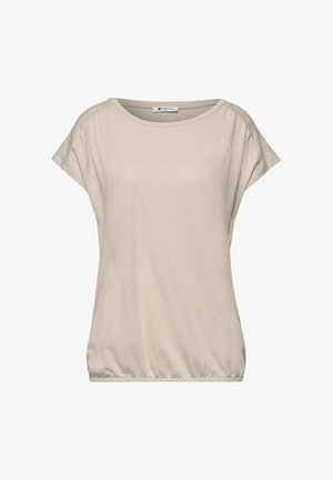 Beżowa bluzka z krótkim rękawem, okrągłym dekoltem i marszczonym elastycznym dołem, wykonana z miękkiego materiału.