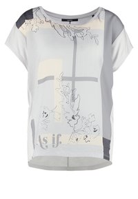 Lehký, volný top s šedobílou barevnou paletou, květinovými obrysy a textem "Jako by." Jednoduchý, moderní design.