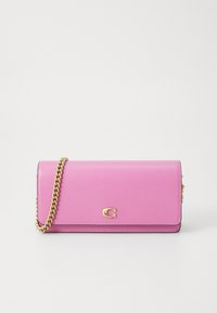 Pink leather wallet with a gold chain strap, featuring a front flap and embossed logo. Smooth texture with minimalistic design.