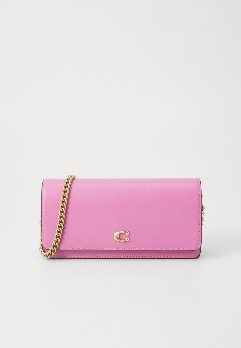 Pink leather wallet with a gold chain strap, featuring a front flap and embossed logo. Smooth texture with minimalistic design.