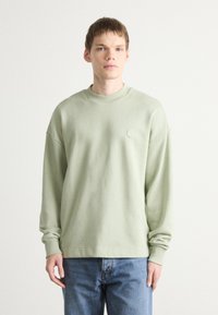 HUGO NINNYO - Felpa - light pastel green
