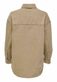 Světle hnědá denimová košile s klasickým límečkem, dlouhými rukávy s knoflíkovými manžetami a rovný lem na zadní straně se subtilními švy.