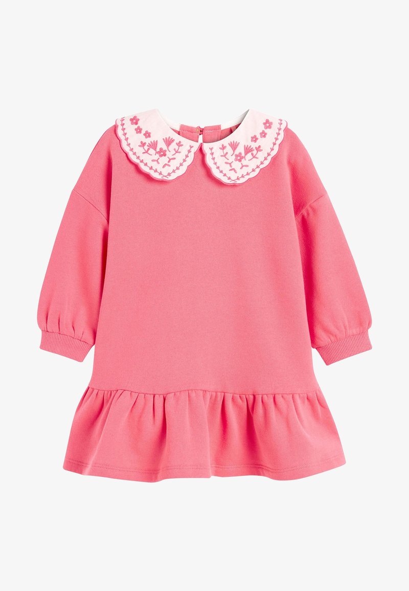 Robe rose à manches longues pour tout-petit avec ourlet à volants et col blanc arrondi brodé de motifs floraux roses.