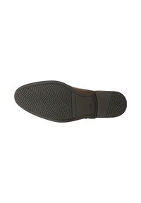Sola di scarpa in gomma nera con motivo di battistrada a zigzag. Forma leggermente sagomata e bordi lisci, progettata per aderenza e durata.