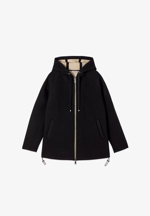 Veste à capuche noire avec fermeture éclair, doublure intérieure beige, manches longues, deux poches avant et cordons ajustables à l'ourlet.