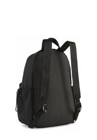 Sac à dos noir avec un corps rembourré, des bretelles réglables, une poche latérale avec cordon de serrage et une texture de tissu lisse. Design simple et fonctionnel.