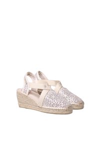 Beige espadrille wedges met een geweven jute zool, bovenwerk van stof met lacepatroon en gekruiste elastische banden voor een veilige pasvorm.