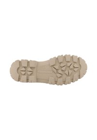 Beige schoenzool met textuurpatronen voor grip, voorzien van hoekige noppen voor tractie en een glad centraal gedeelte. Gemerkt met modelnummer 37.