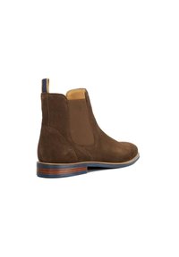 Brown suede ankle boot with elastic side panels, a blue accent tab, and a contrasting brown sole with a thin layer of lighter wood.
