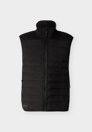 Chaleco acolchado sin mangas negro con cremallera frontal, cuello alto y bolsillos laterales con cremallera, colocado plano sobre un fondo claro.