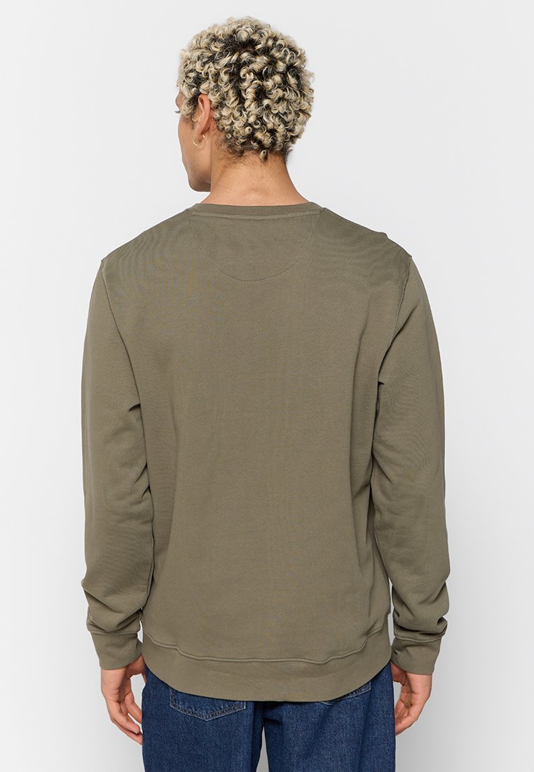 Olive zielony sweter z miękkiej mieszanki bawełny, z długimi rękawami, okrągłym dekoltem i ściągaczami, o gładkiej fakturze.