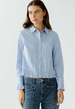 Striped blue shirt with long sleeves, button-down collar, and ruffled hem. Made of lightweight fabric with subtle sheen and pleated cuffs.