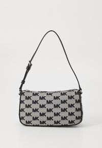 Black and grey patterned handbag from Michael Kors, featuring a zip closure and a shoulder strap with adjustable length.