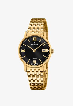 Zlata zapestna ura z zlatim metalnim paščkom, črnim številčnico, rimskimi številkami za ure, okencem za datum ob 3. uri in zlatimi kazalci, ki kažejo 10:10.