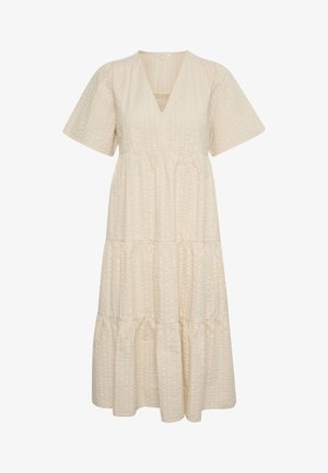 Vestido de color crema con volantes, escote en V, mangas cortas y tejido texturizado. Presenta una cintura fruncida y una silueta fluida.