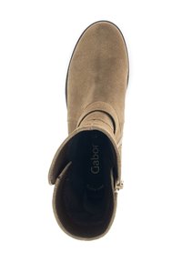 Brown suede ankle boot with a rounded toe, wide cuff, and a silver buckle accent; interior branding visible inside.