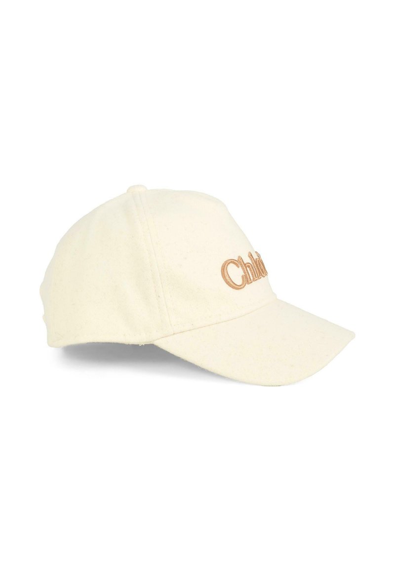 Cappello color crema con una texture morbida, visiera curvata e logo "Child" ricamato in marrone sulla parte anteriore. Design classico e vestibilità regolabile.