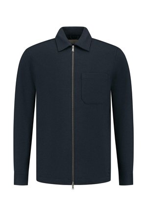 Tumesinine jakk, millel on krae, täispikk zipper es front, ja üks vasaku rinna tasku. Valmistatud tekstuuriga kangast, pikkade varrukatega ja kohandatud lõikega.
